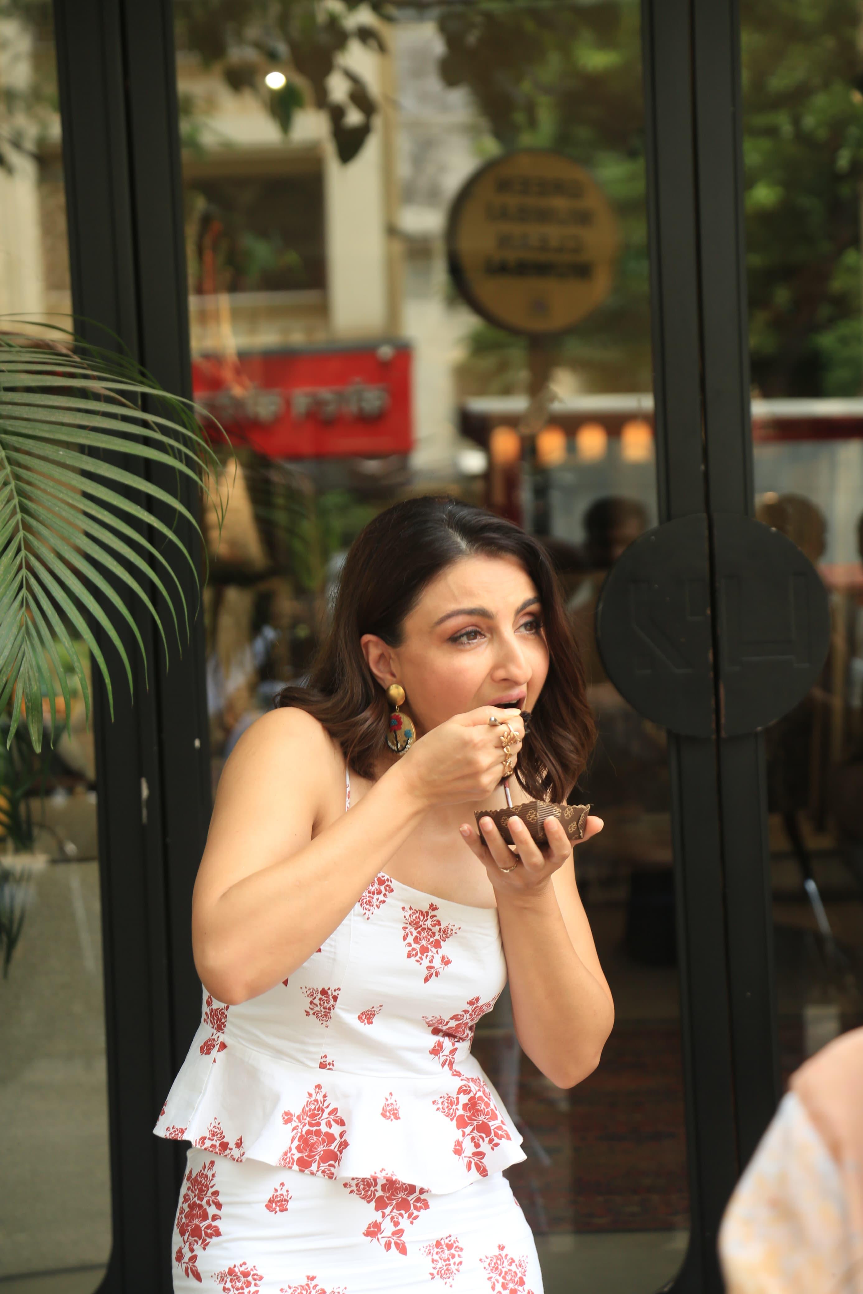 Soha Ali Khan was seen enjoying a quick bite as she stepped out in the city in a white and pink floral dress.